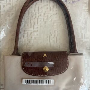 Longchamp Beige Tote with Brown Leather Trim and Handles